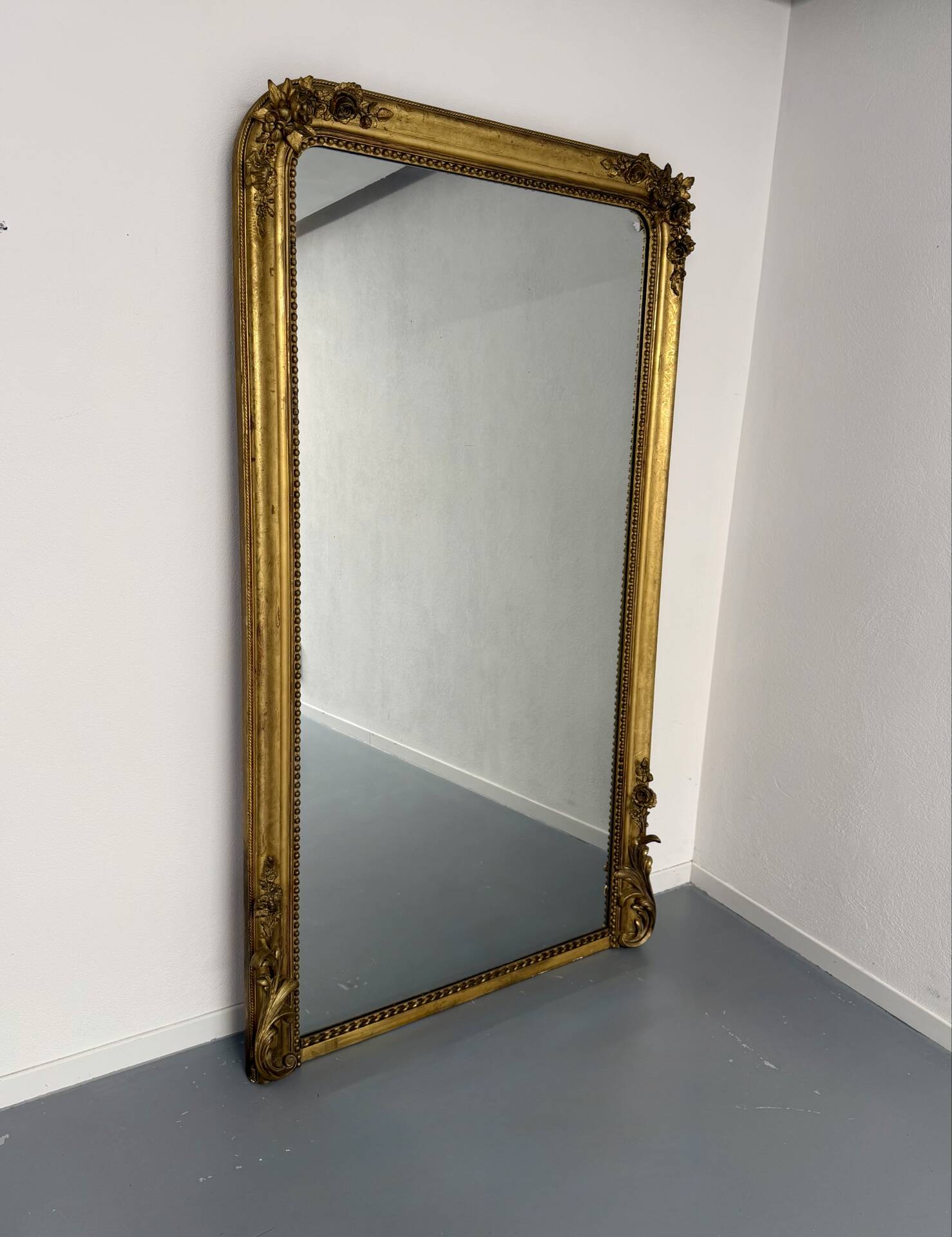 Large Napoleon III mirror with wooden gilded frame, 19th century, 200 cm.