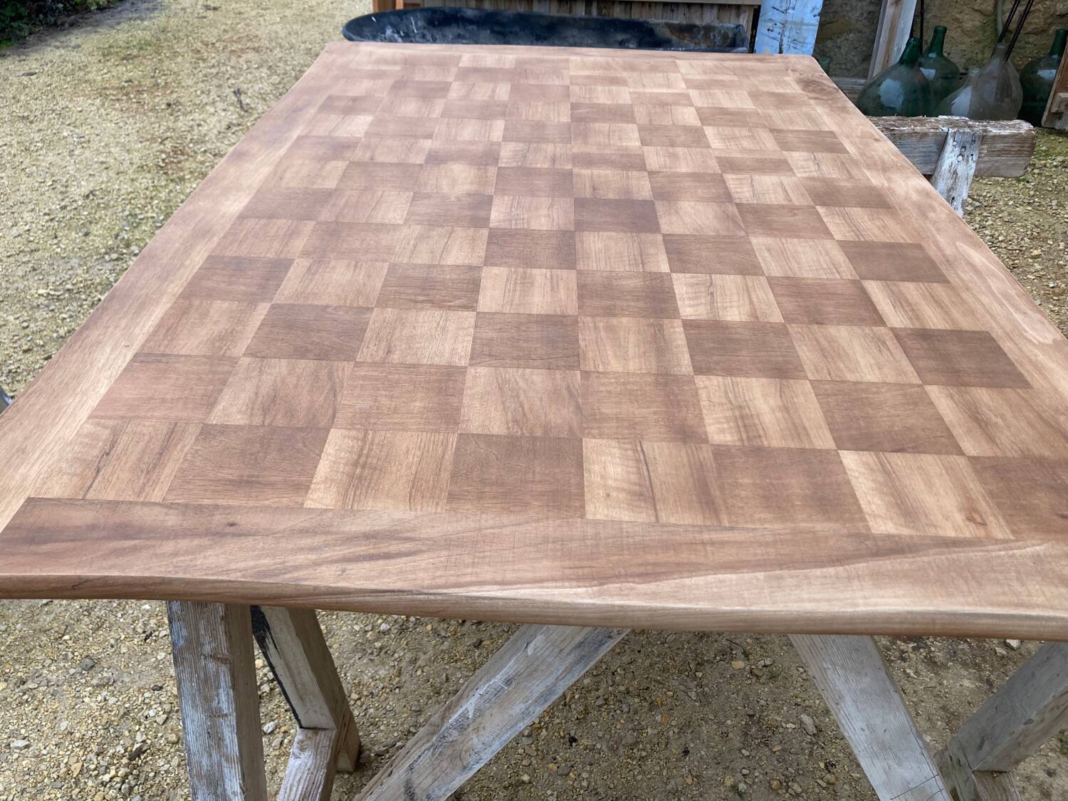 Louis XV style walnut table with a natural wood top.
