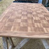 Louis XV style walnut table with a natural wood top.