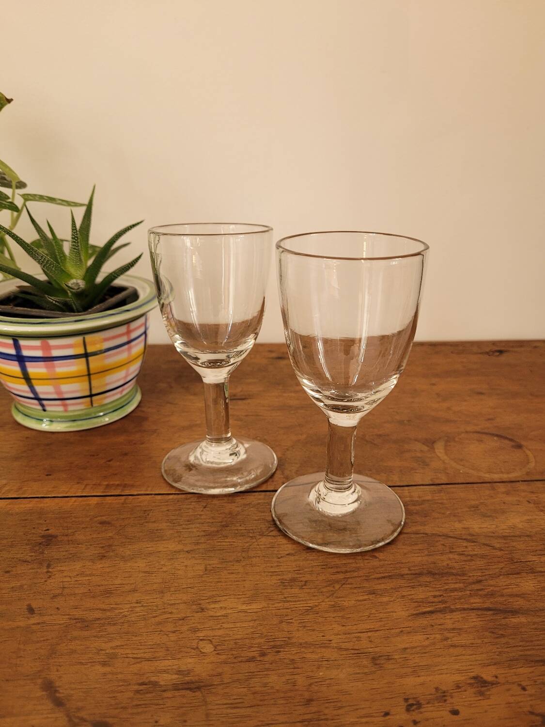 2 small stemmed glasses