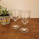 2 small stemmed glasses
