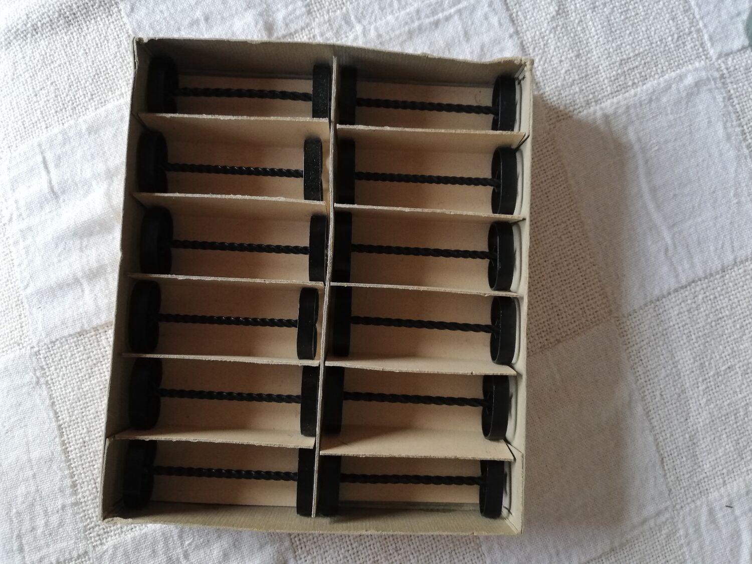 Set of 12 black twisted wrought iron knife holders from the 50s