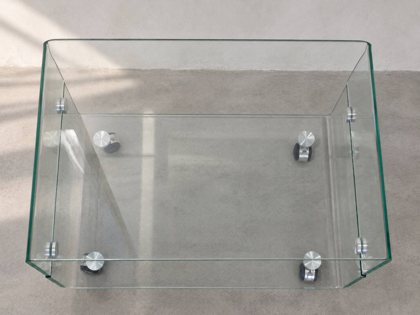 Glass coffee table on wheels