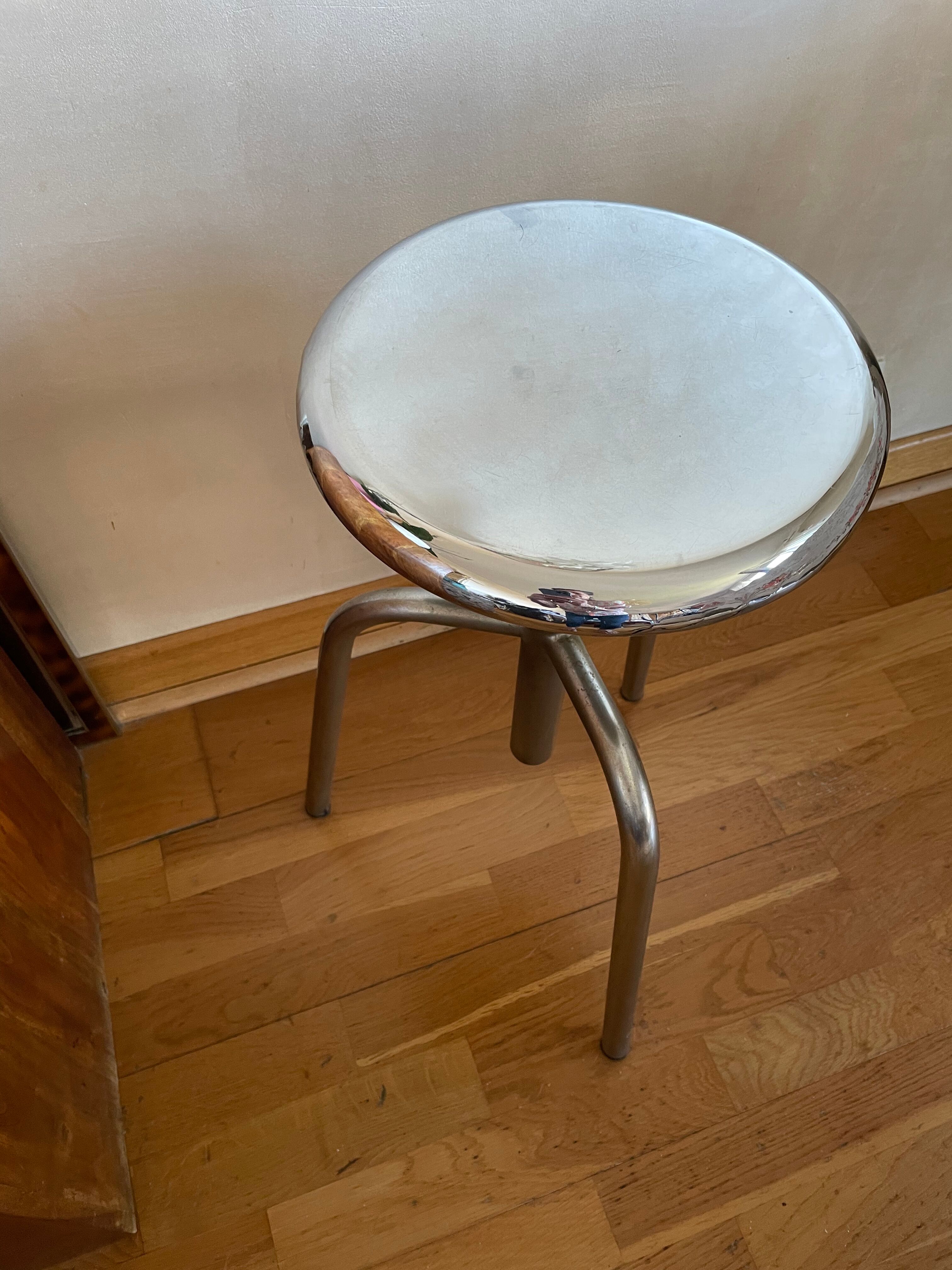 Chrome screw stool of hairdresser workshop