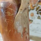 Old bottle in terracotta varnished finish