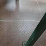 Vintage green perforated metal public bench