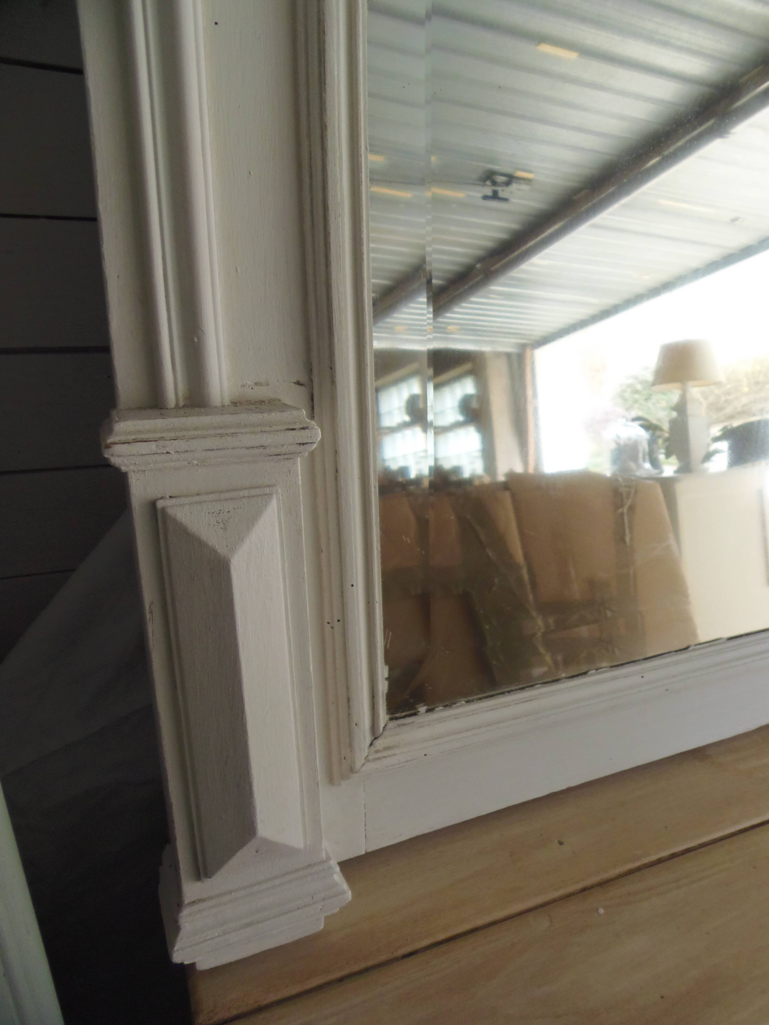 Antique bevelled mirror, frame in pearl grey patinated wood.