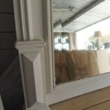 Antique bevelled mirror, frame in pearl grey patinated wood.