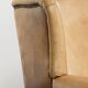 Set of two light cowhide wingback armchairs with a timeless English look