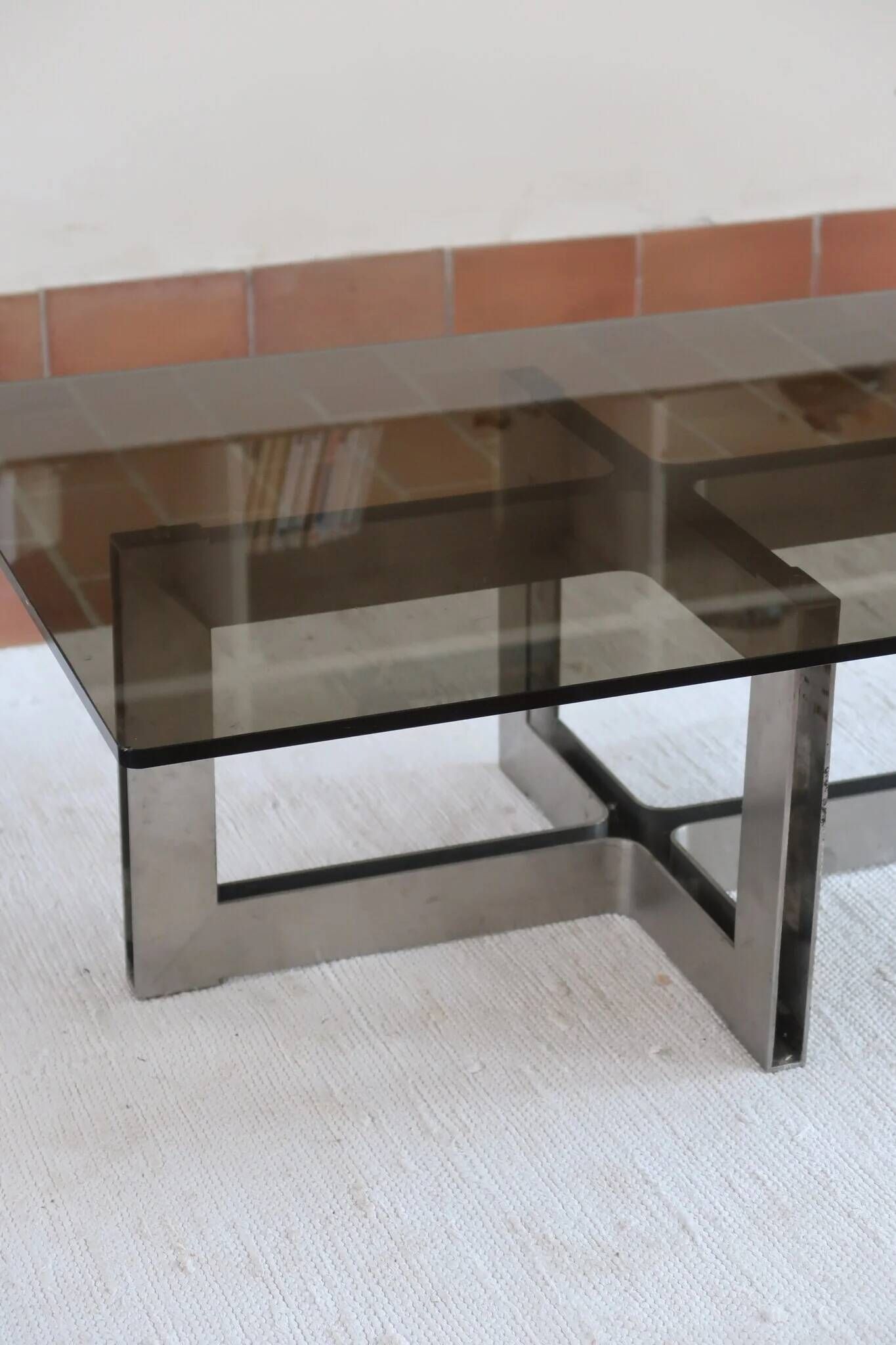 Smoked glass coffee table, brushed stainless steel base, 1970s.