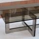 Smoked glass coffee table, brushed stainless steel base, 1970s.