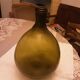 Old green glass demijeanne