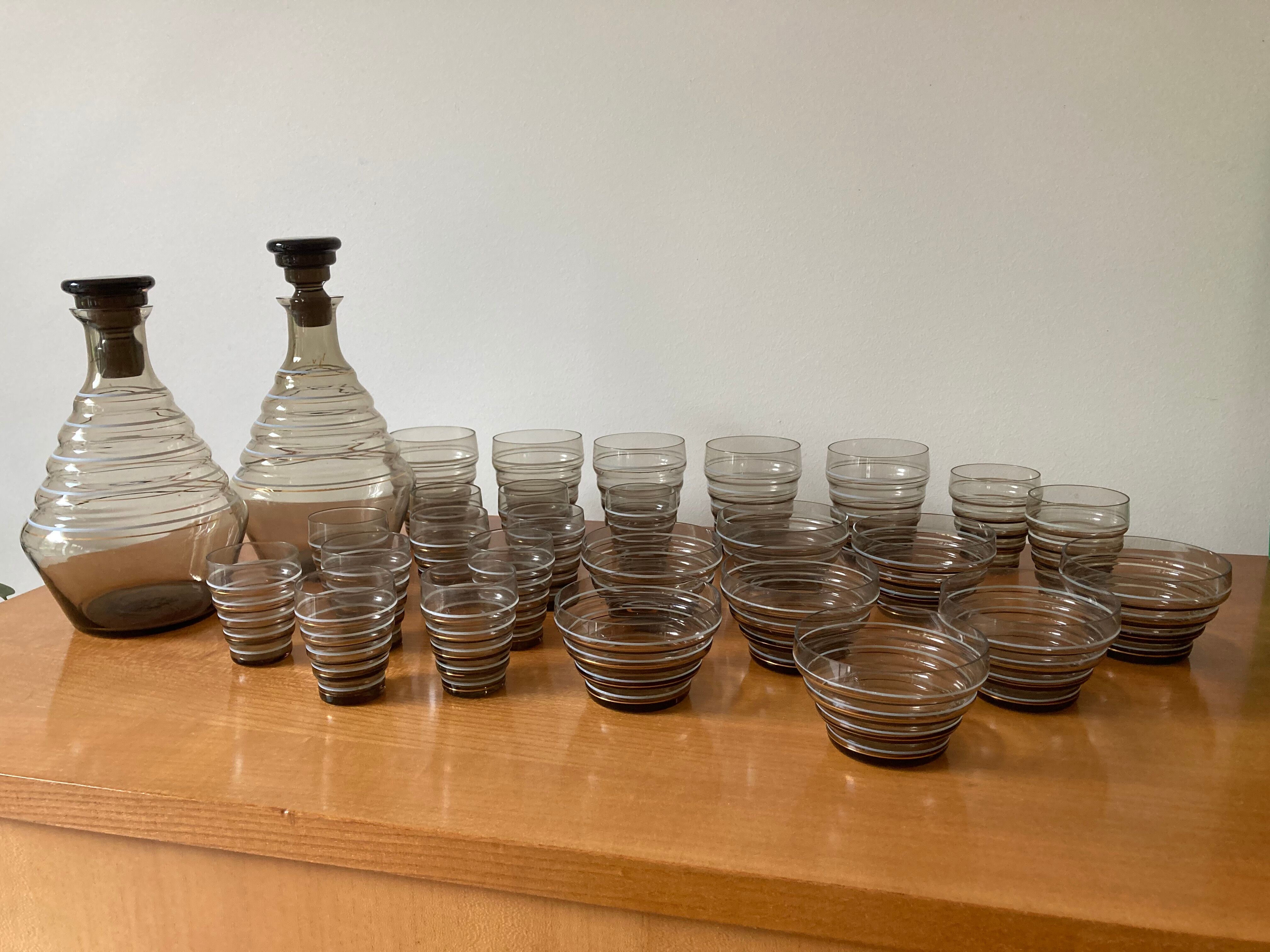 Service of glasses, cups, decanters of the 50s in smoked glass