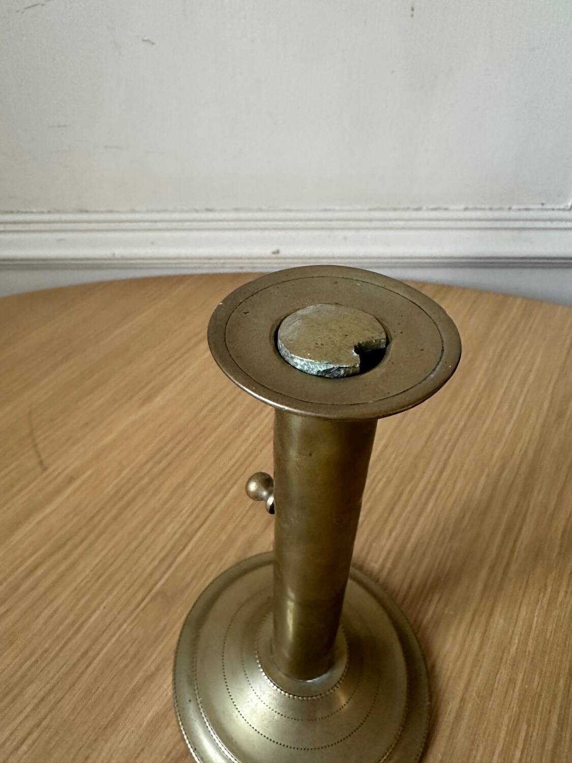 Old brass pull candle holder
