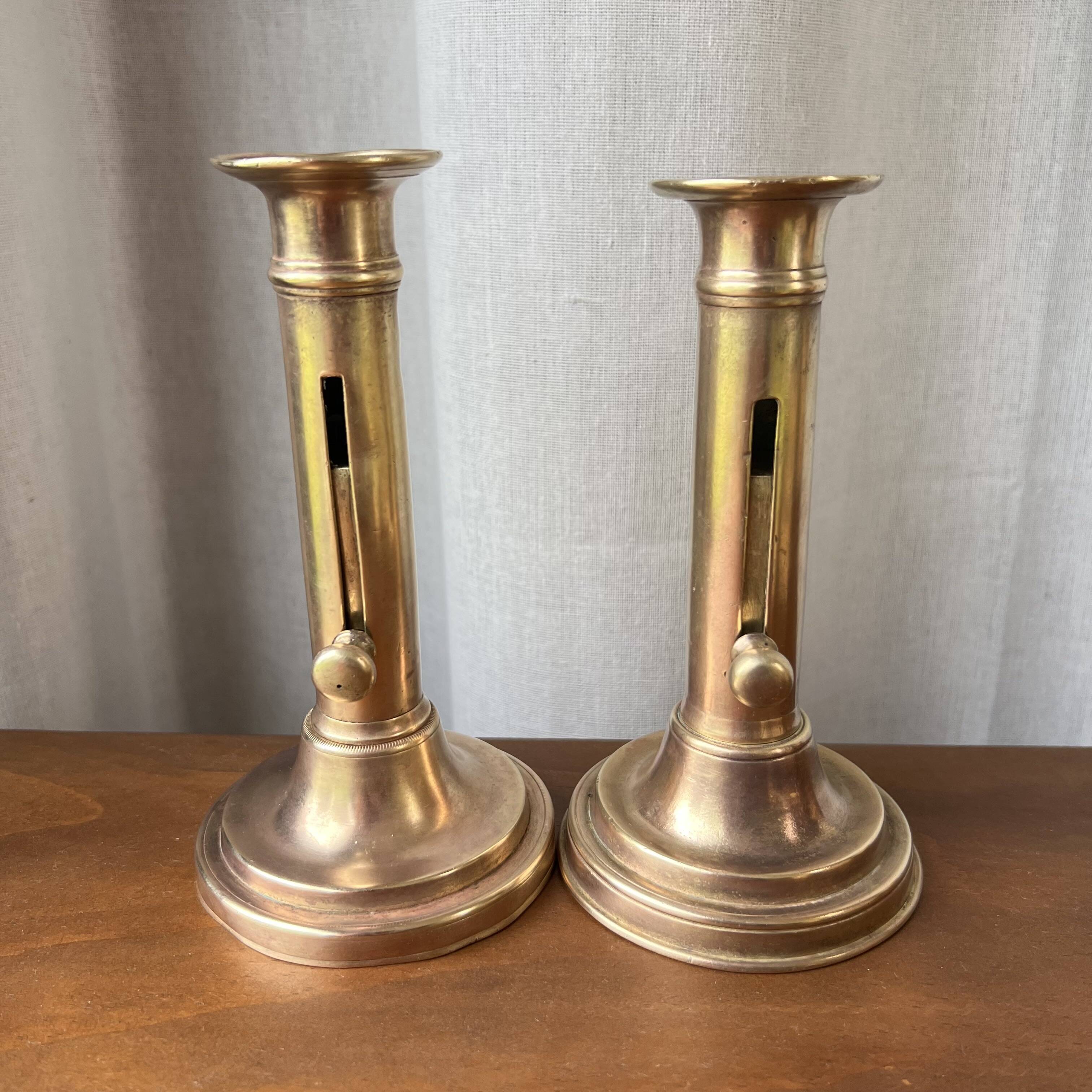 Duo of brass candlesticks