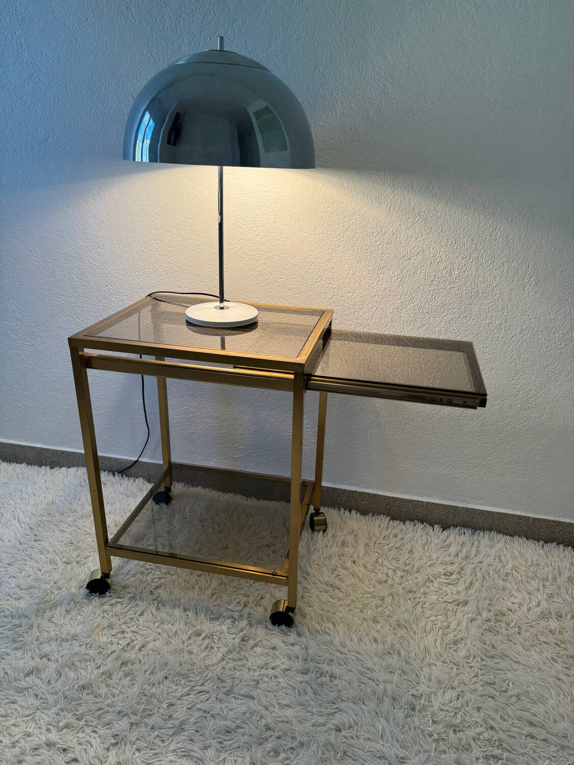 Brass rolling trolley with smoked glass from the 70s