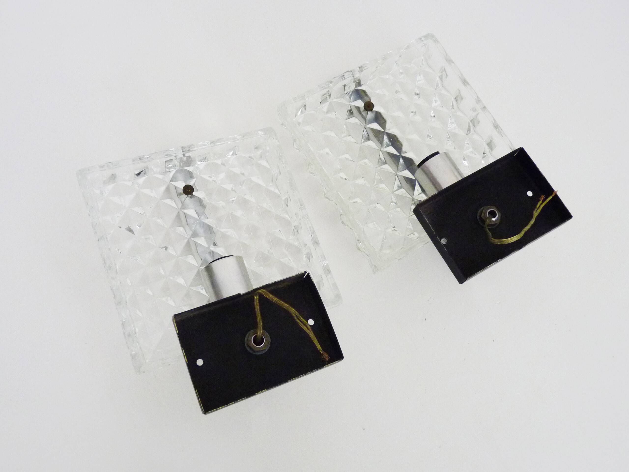 Pair of modernist glass and chrome metal wall sconces. 1960s-70s