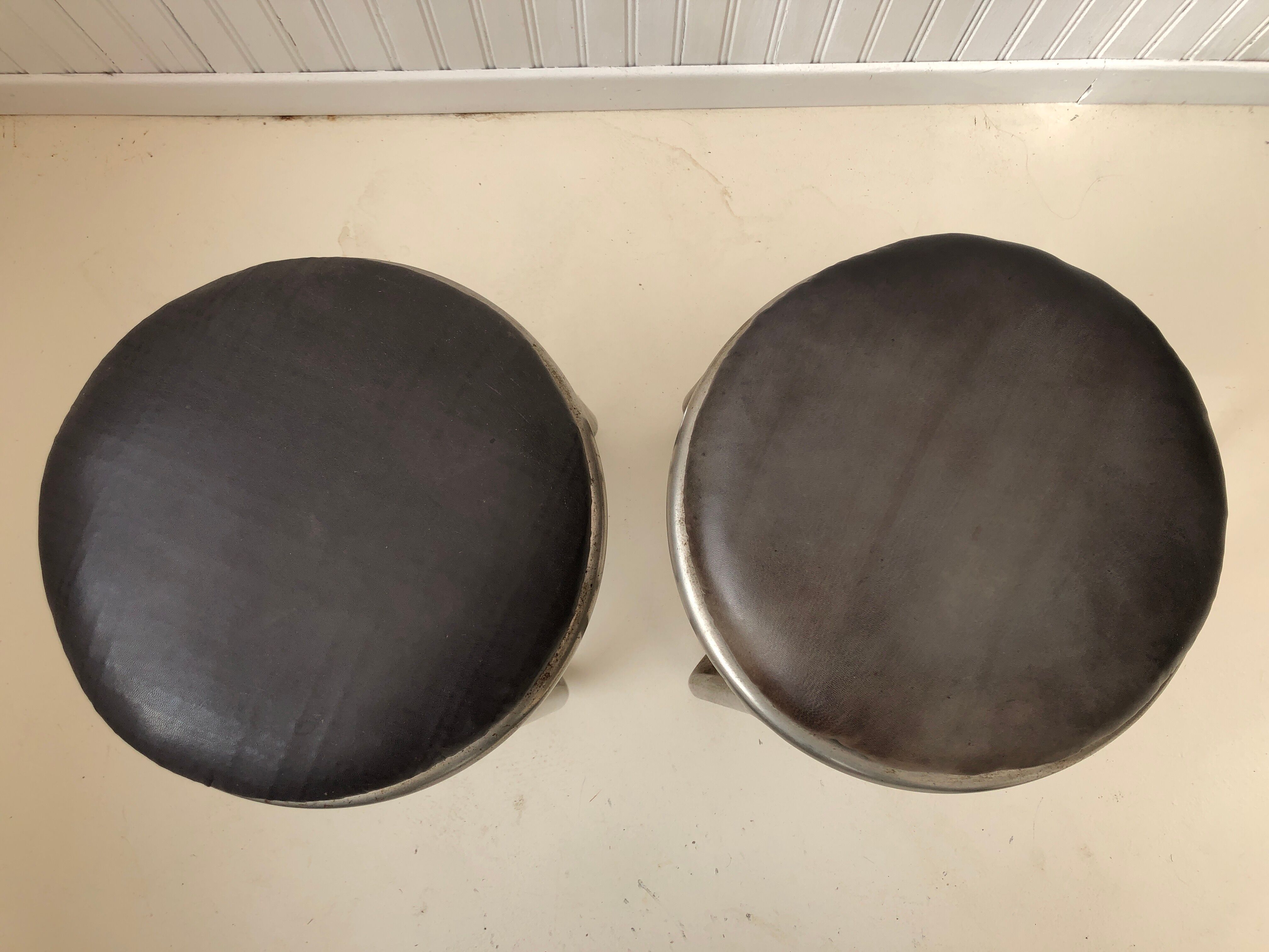 Pair of metal and leather stools