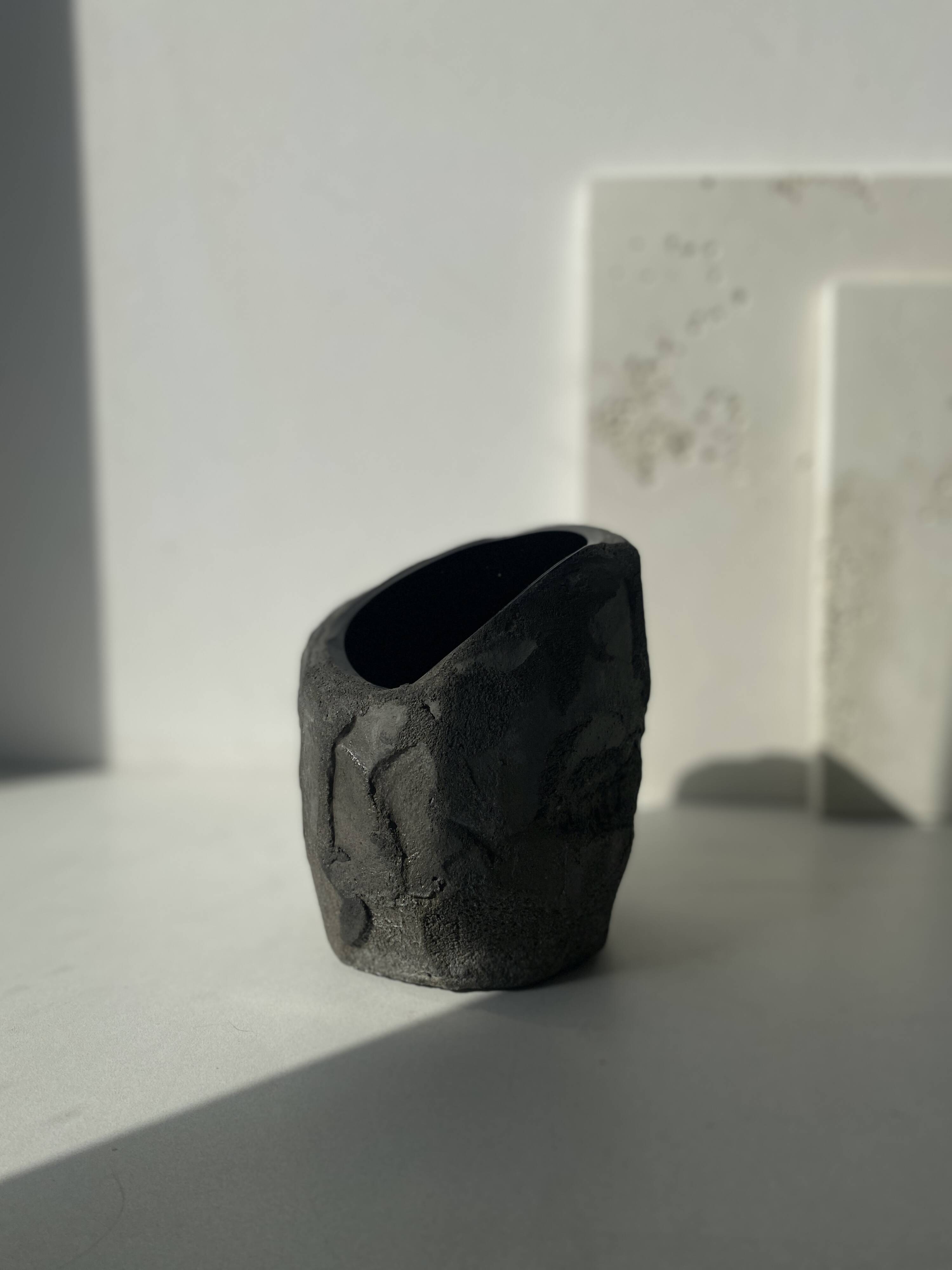 Asymmetrical sculpted concrete vase