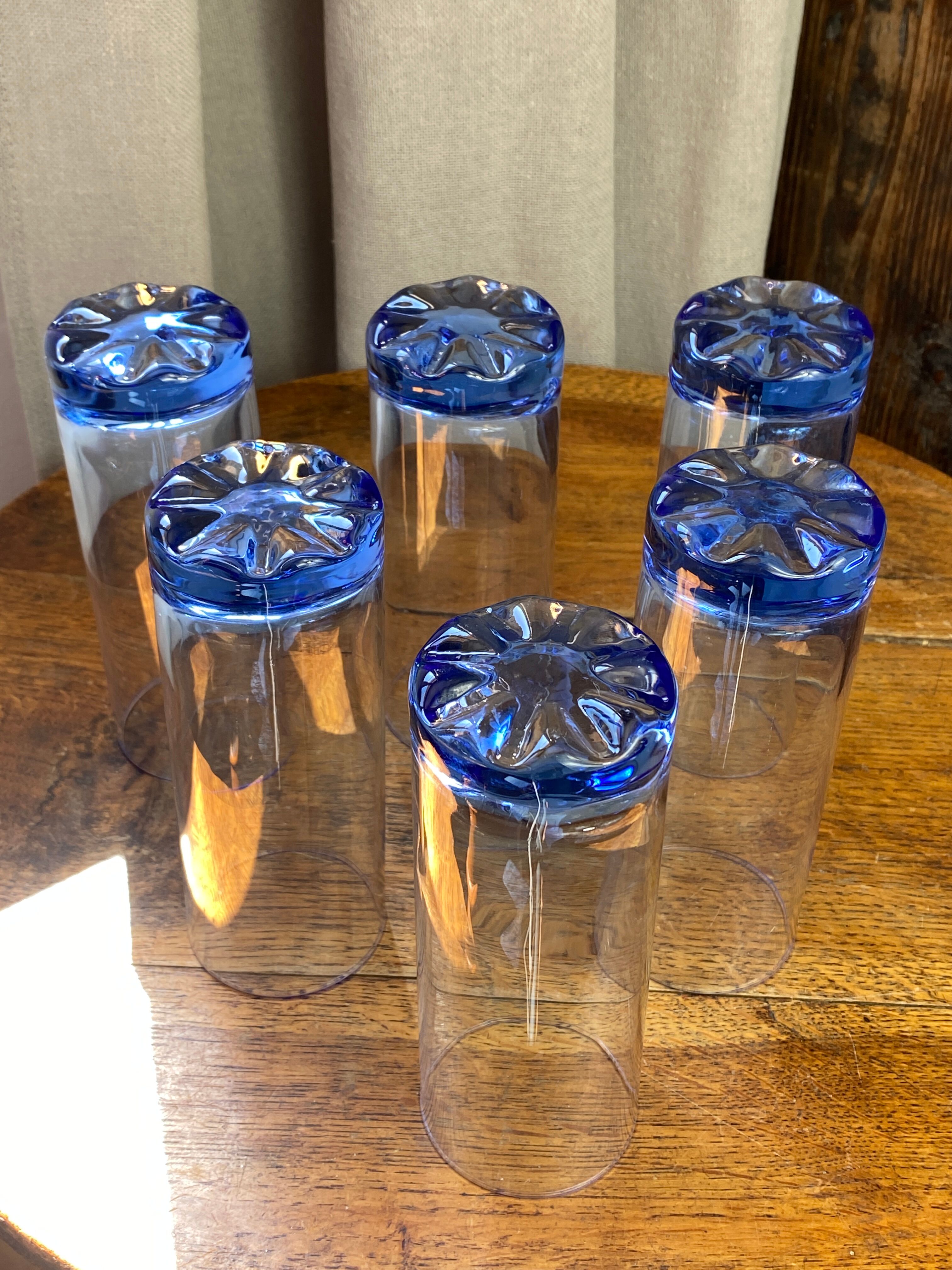 Six blue tube glasses