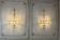 Pair of painted and gilded metal wall sconces adorned with crystals, Italy circa 1920.