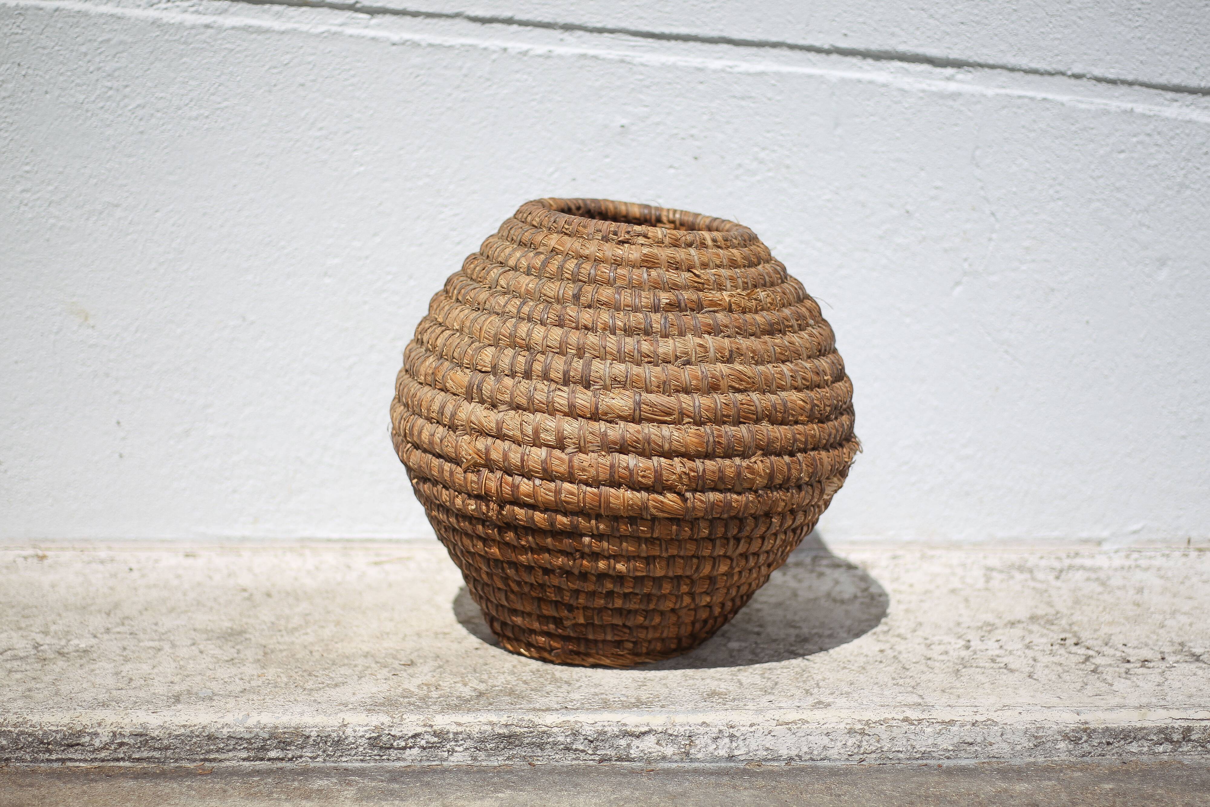 Old basket, burgundy straw and bramble, woven basket, interior decoration