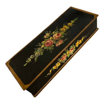 Black jewelry box with flowers inside gray fabric