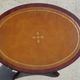 Small side table with an oval top in English style.
