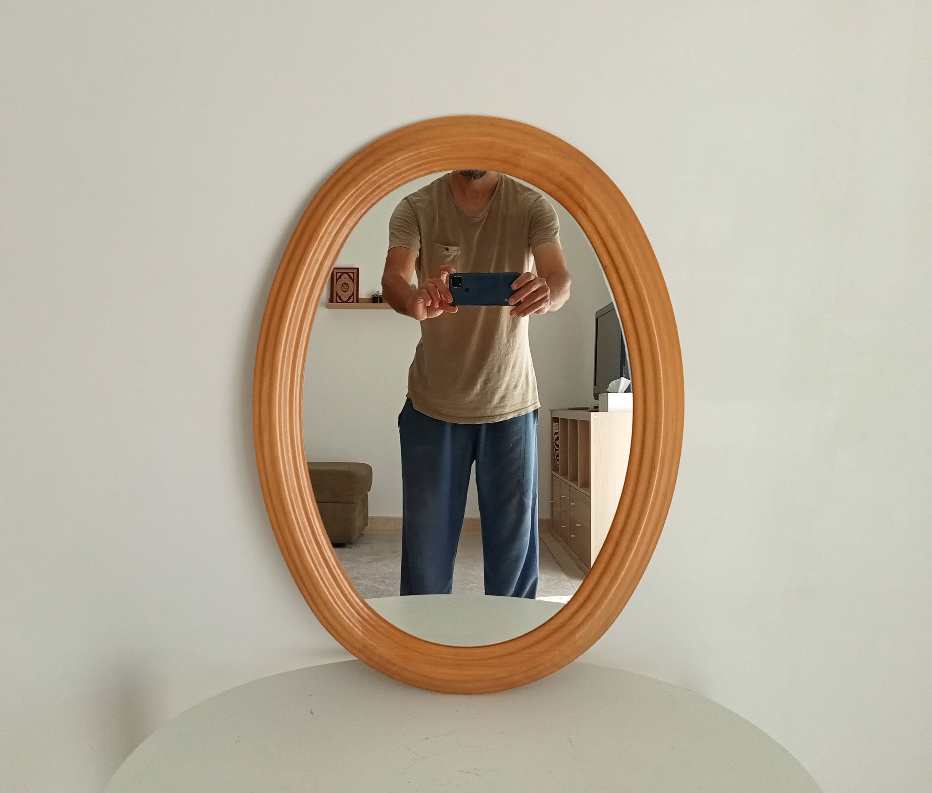 Vintage oval mirror in beech from the 70s/80s.