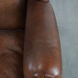 Warm, cosy and comfortable vintage sheepskin ear armchair with character