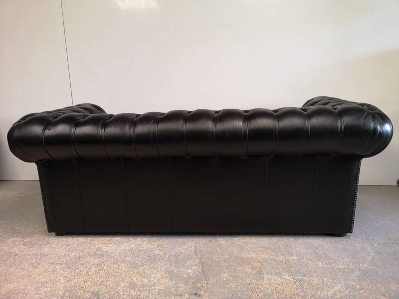 Black leather chesterfield sofa