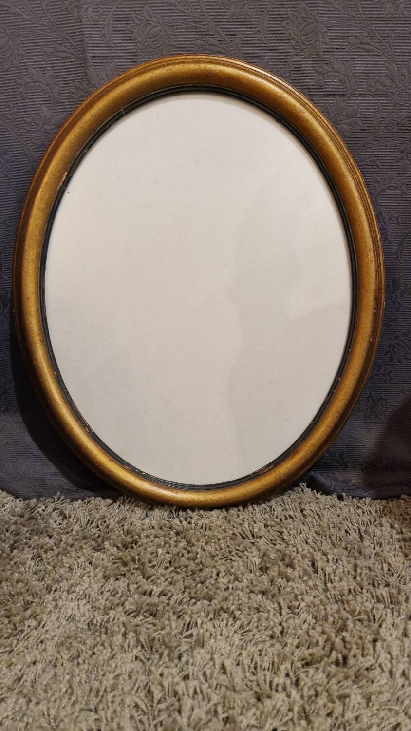 Golden oval frame