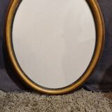 Golden oval frame