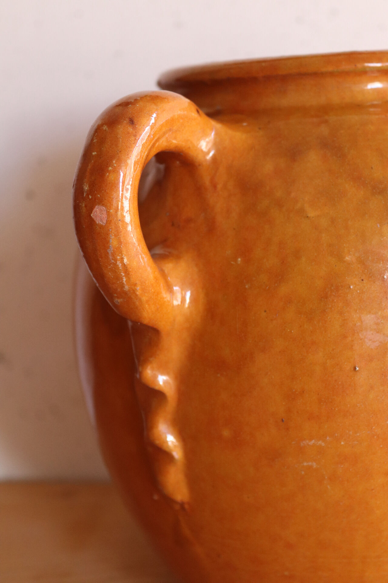 Old honey-glazed pot with two handles