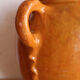 Old honey-glazed pot with two handles