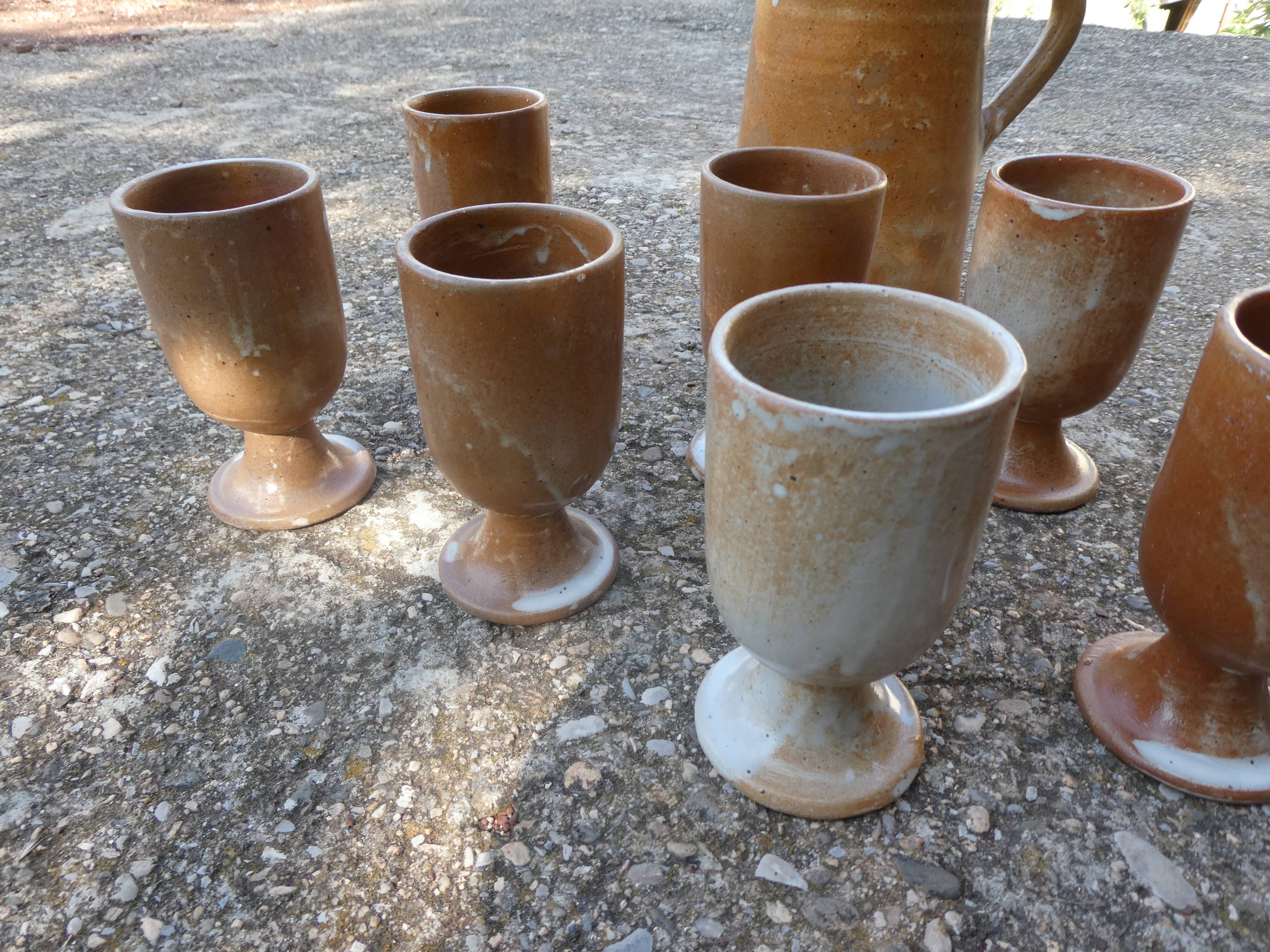 Service mazagrans and decanter in enamelled stoneware.