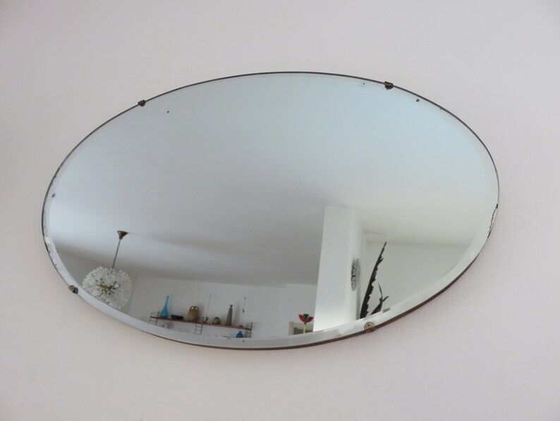 Beveled wall mirror, oval, on wood, with chain Art Deco years 30 40
