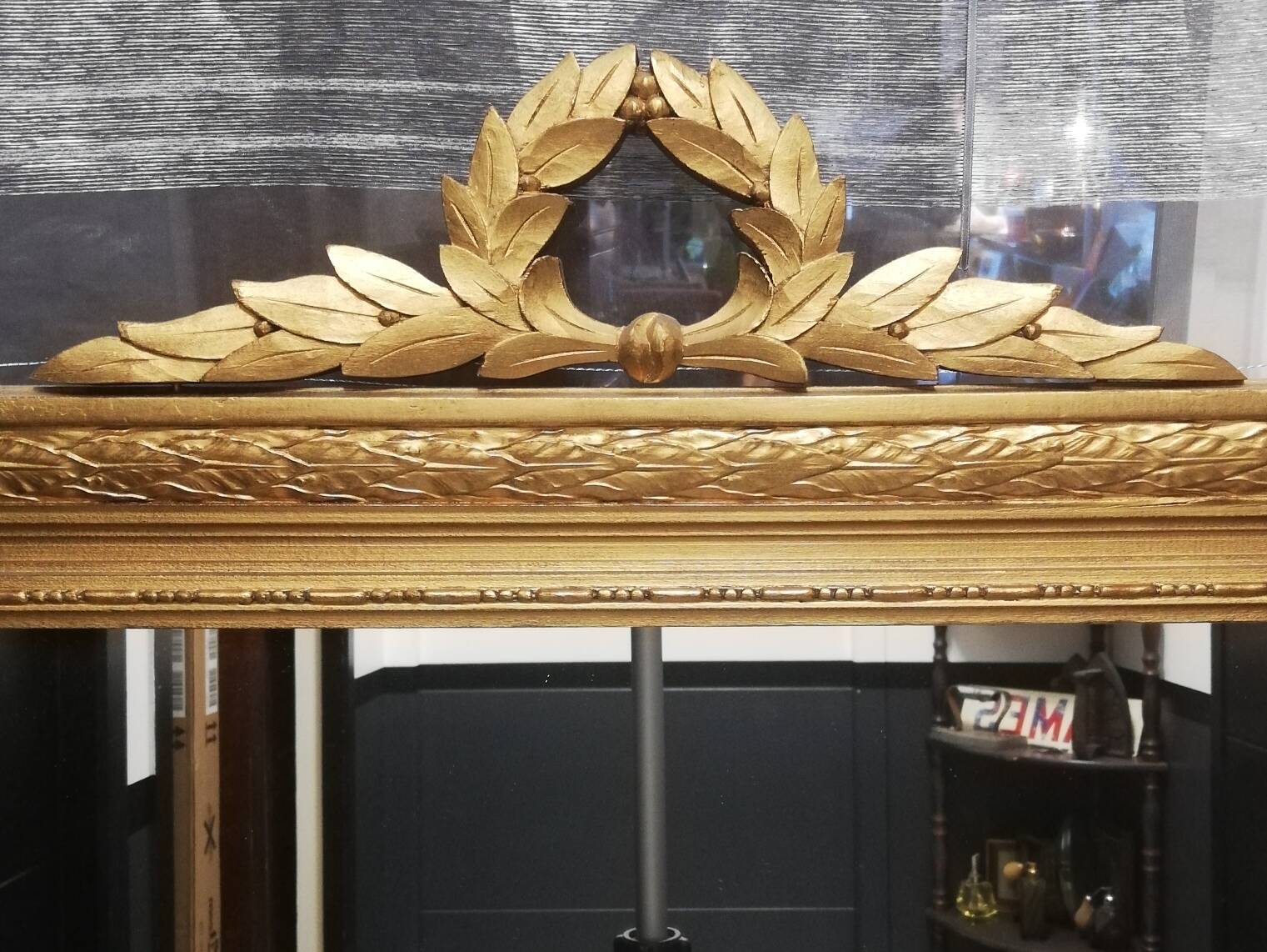 Carved wooden pediment mirror