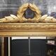 Carved wooden pediment mirror