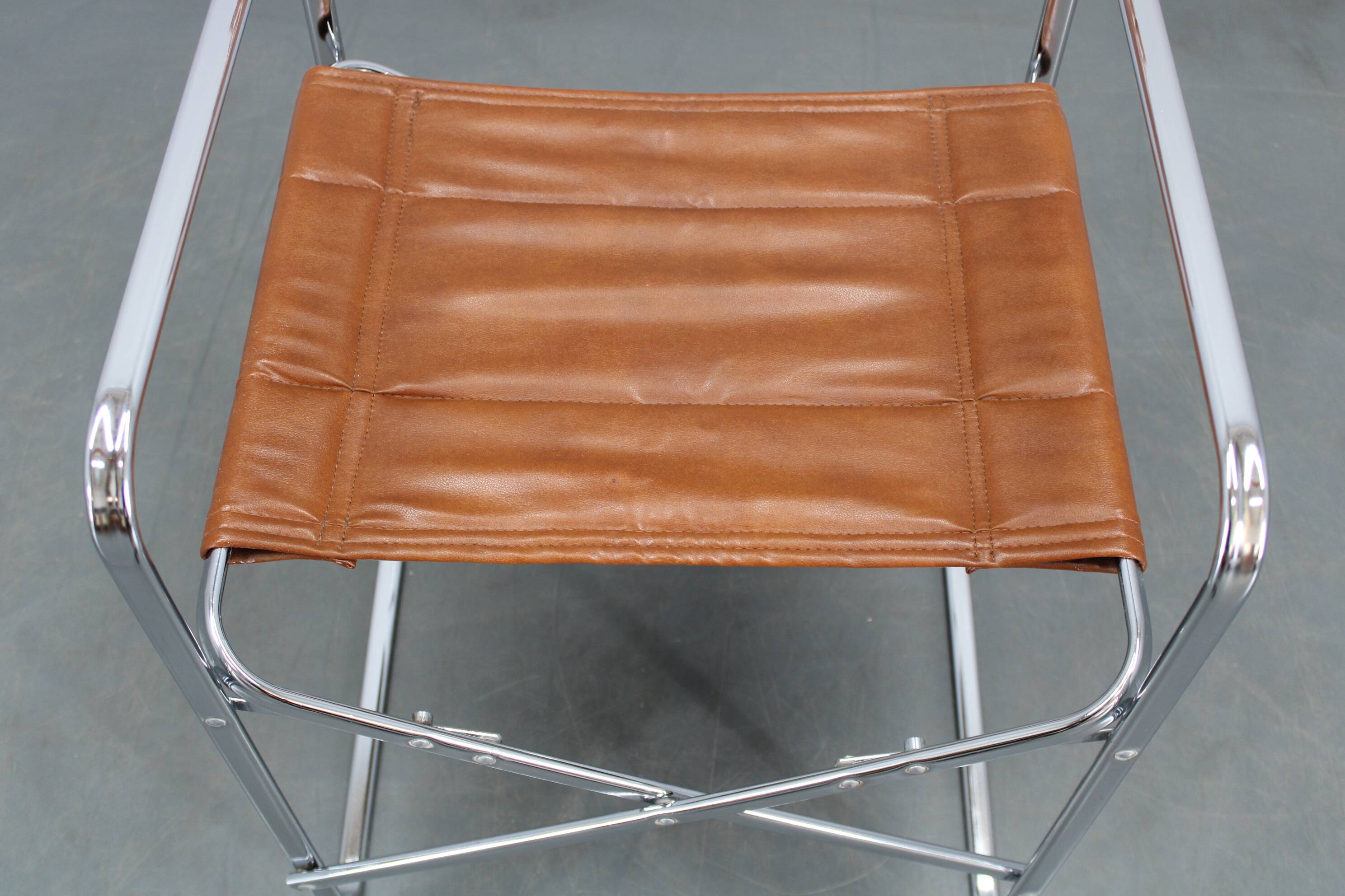 1970s pair of Italian folding chairs with leatherette upholstery