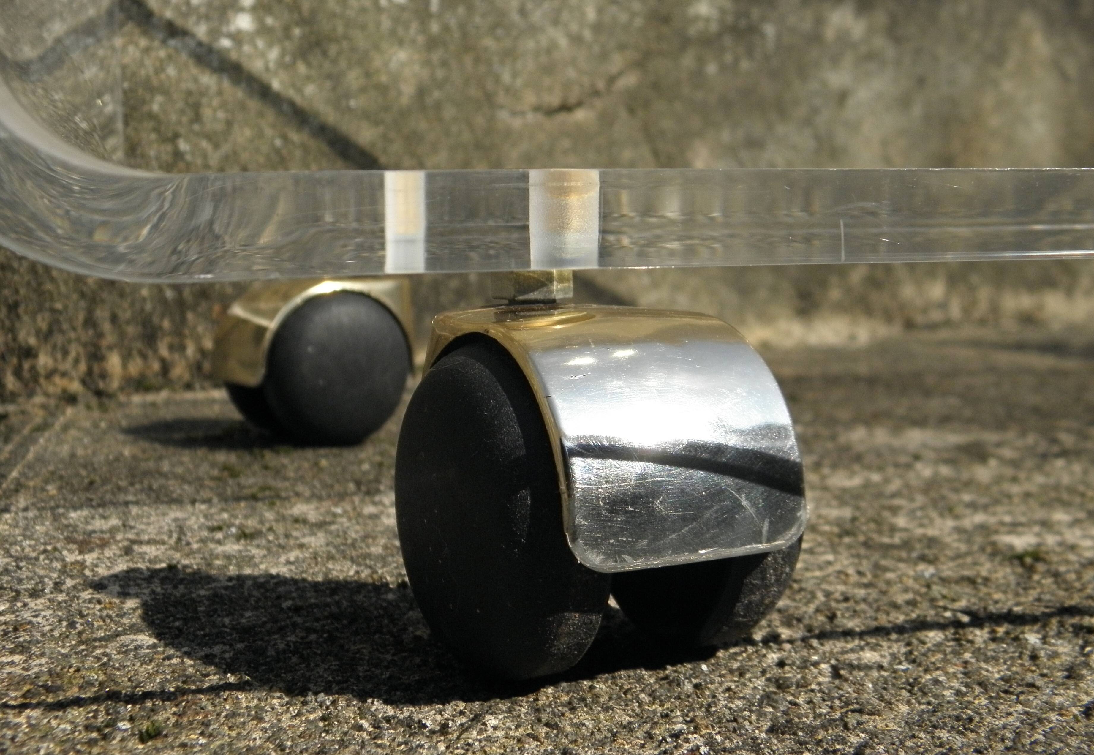 Plexiglass coffee table on wheels