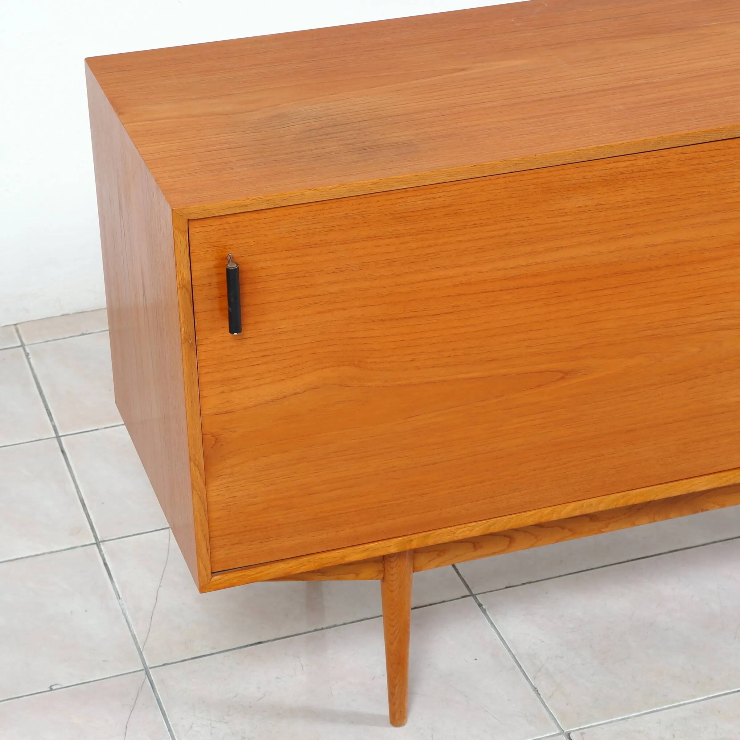 Swedish teak sideboard with leather handles