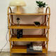 Vintage shelf on legs made of rattan and wood.