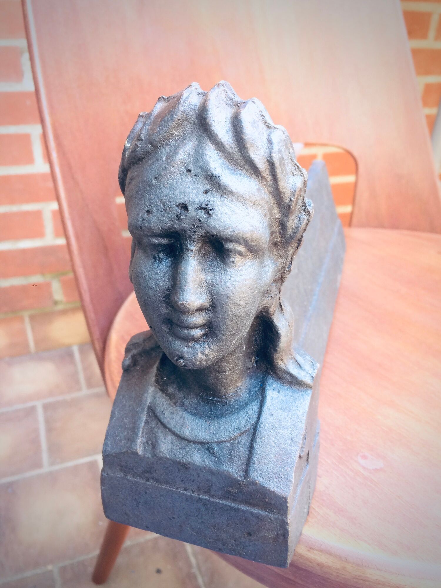 Pair of cast-iron chenet characters with laurels