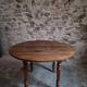 French antique round dining table in walnut, circa 1880–1900.