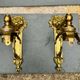 2 brass lion Empire wall sconces