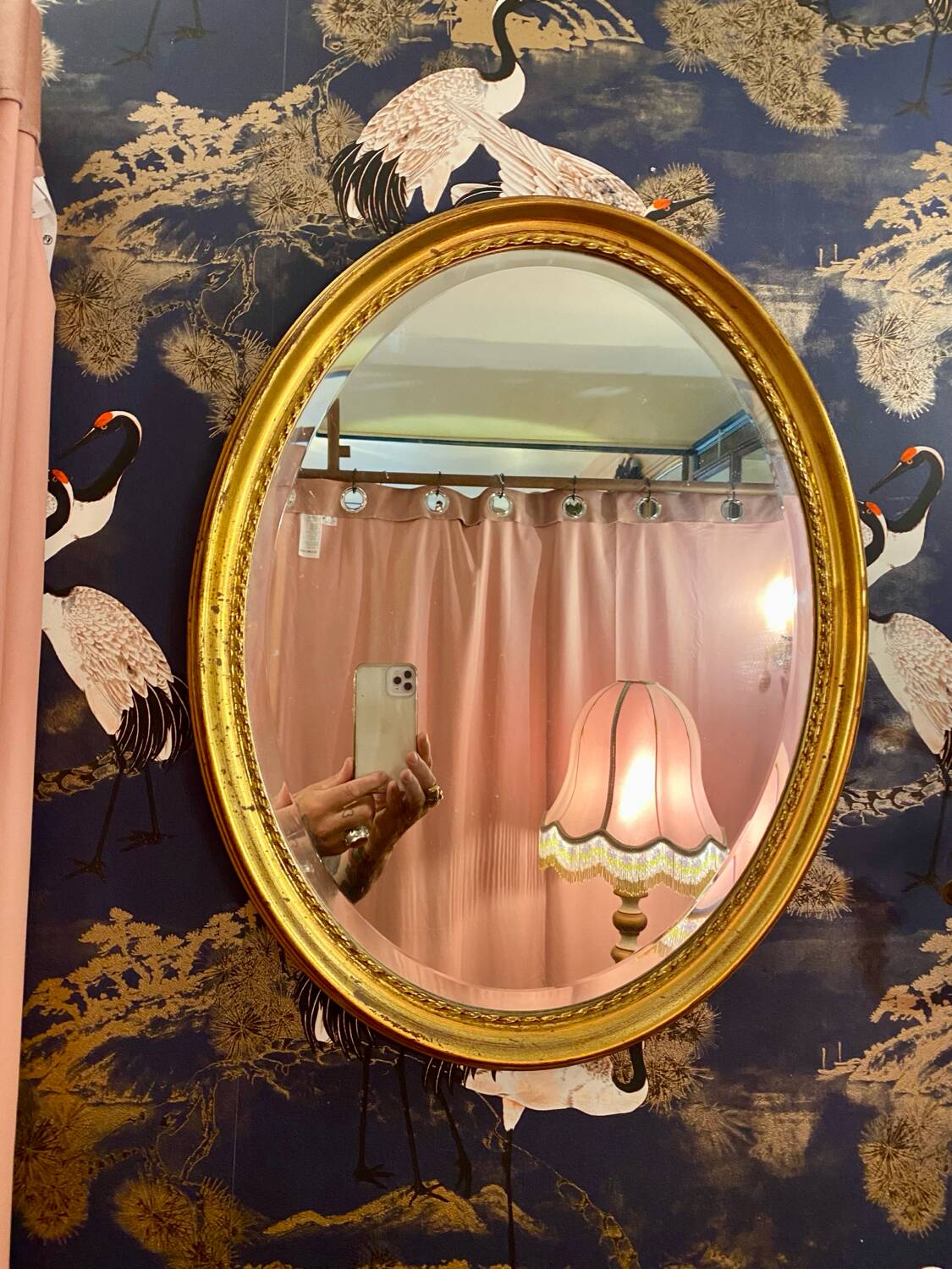 Miroir Deknudt ovale cadre doré.