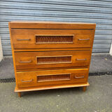 Vintage 1970s chest of drawers: wood and rattan, splayed legs.