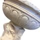 Vintage white concrete garden statue adorned with planter.