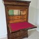 Mahogany secretary desk with marble top and interior mirror.